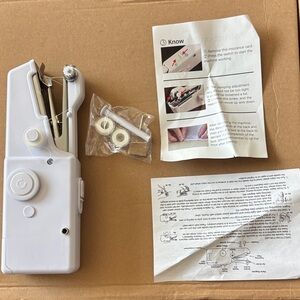 Hand held sew machine-